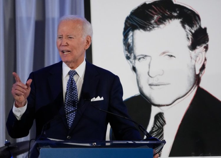 Biden warns of dark days for the country as he urges Americans to stay optimistic
