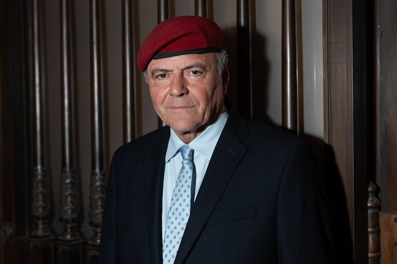 Curtis Sliwa posed in his signature red beret for the fashion show.