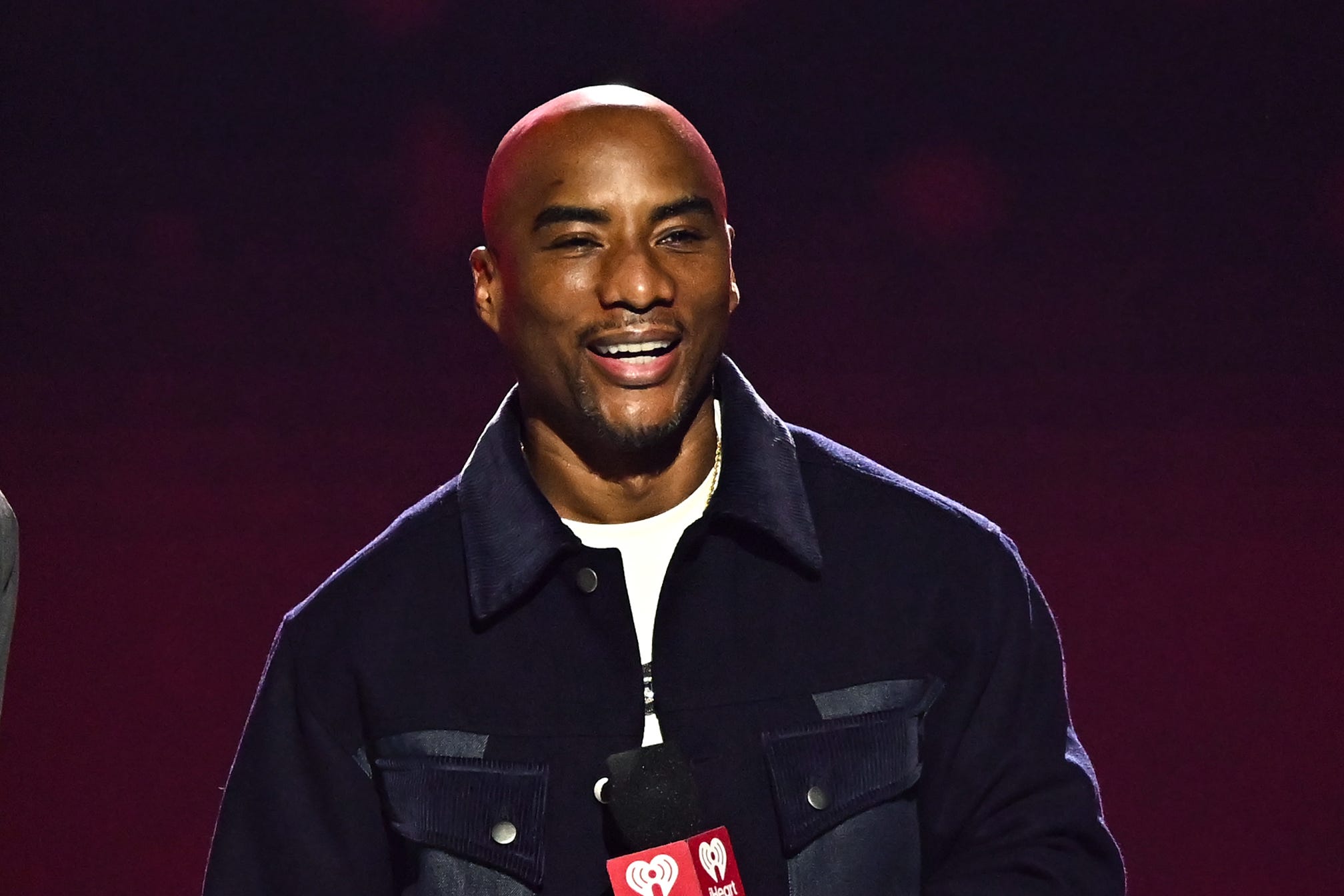 LAS VEGAS, NEVADA - SEPTEMBER 19: (L-R) Ryan Seacrest and Charlamagne tha God speak onstage during the 2025 iHeartRadio Music Festival at T-Mobile Arena on September 19, 2025 in Las Vegas, Nevada. (Photo by Bryan Steffy/Getty Images)