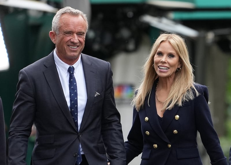 WASHINGTON, DC - MAY 22: Health and Human Services Secretary Robert F. Kennedy Jr. and his wife Cheryl Hines walk together at the White House on May 22, 2025 in Washington, DC. Kennedy was at the White House today to release a new Make America Healthy Again Commission report that blamed the rise in chronic illnesses on ultraprocessed foods, chemical exposures, lifestyle factors and excessive use of prescription drugs. (Photo by Kevin Dietsch/Getty Images)