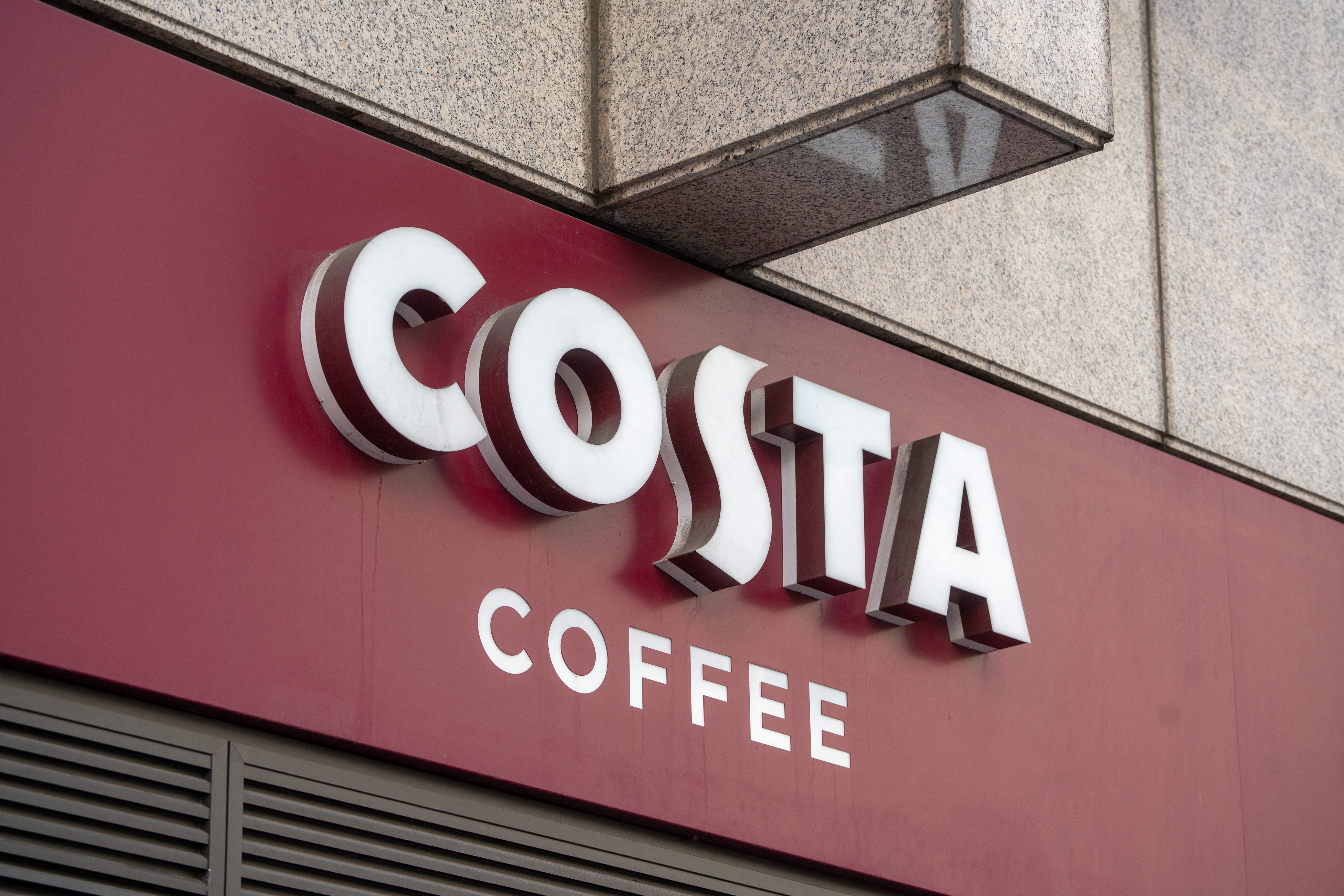 A Costa Coffee sign above one of the chain's cafes