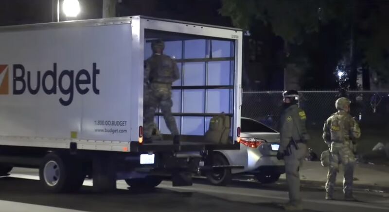 The Budget rental vans used for the raid.