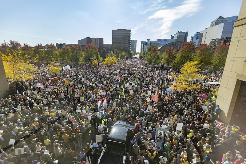 Demonstrators gather in Commons Park for the 'No Kings!' rally and march on October 18, 2025, in Minneapolis, Minnesota, United States. The rally was one of more than 2,700 synchronized protests across the United States drawing millions of participants voicing concerns over the direction of presidential power.