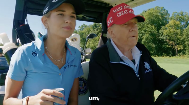 Donald Trump golfing with granddaughter Kai Trump.
