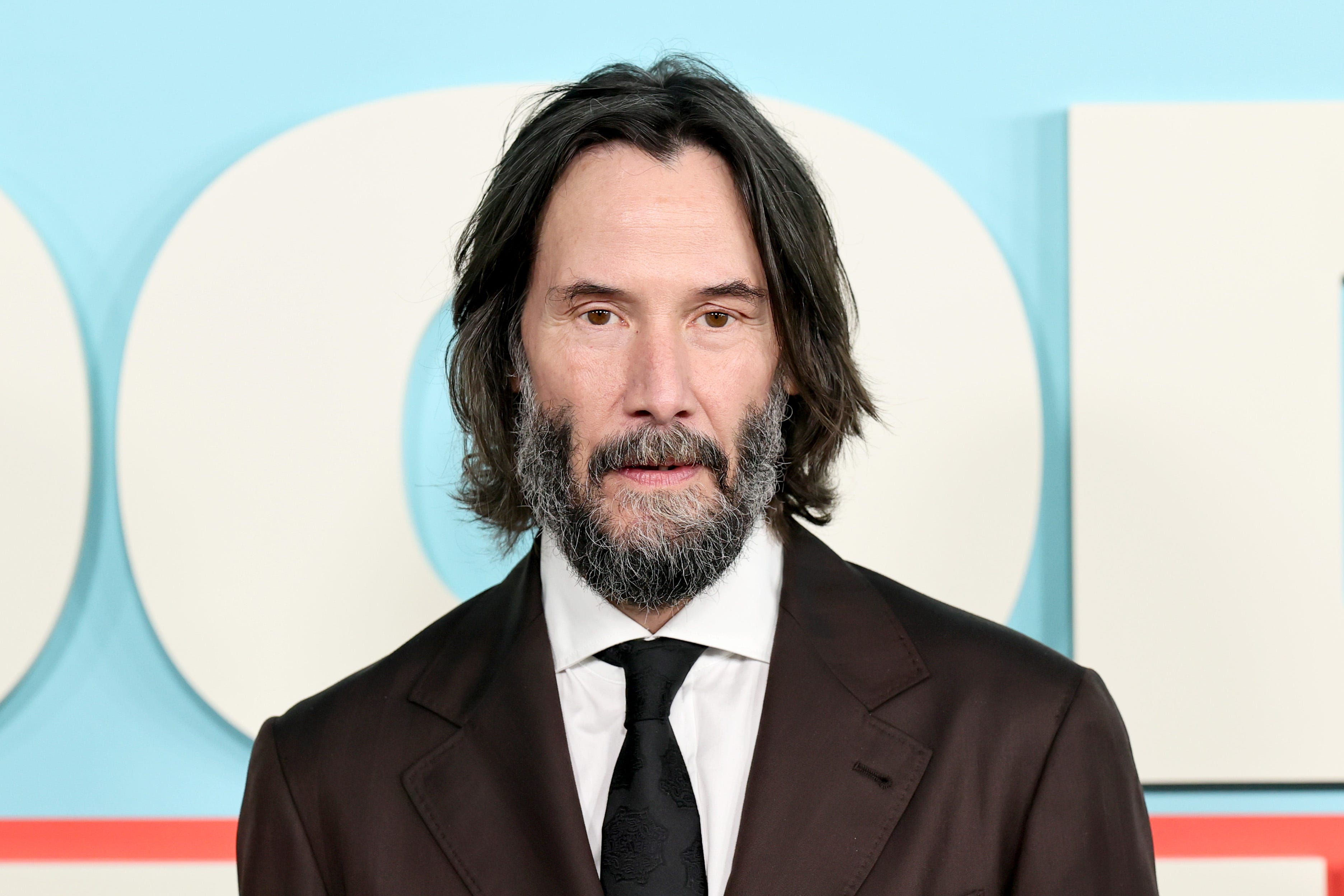Keanu Reeves in a suit and tie