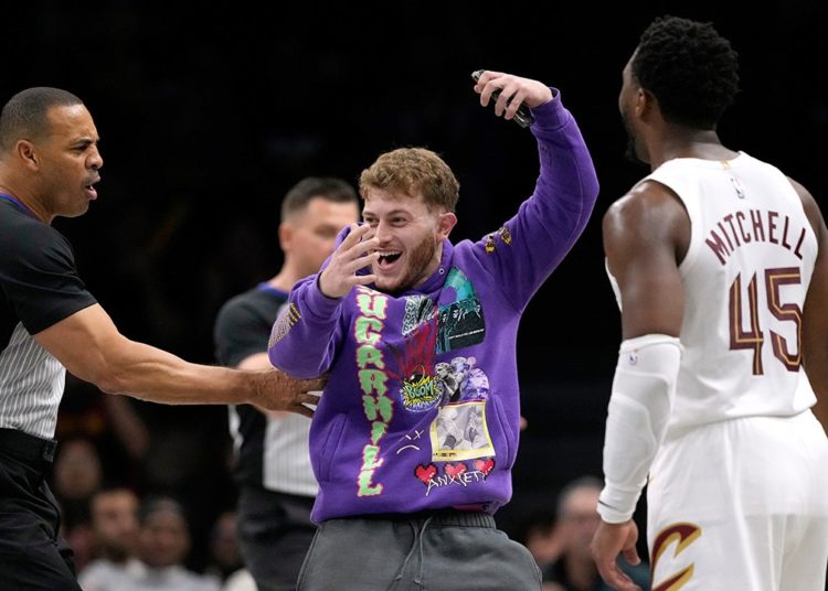 Fan storms court during NBA game seeking selfie with Cavaliers star Donovan Mitchell