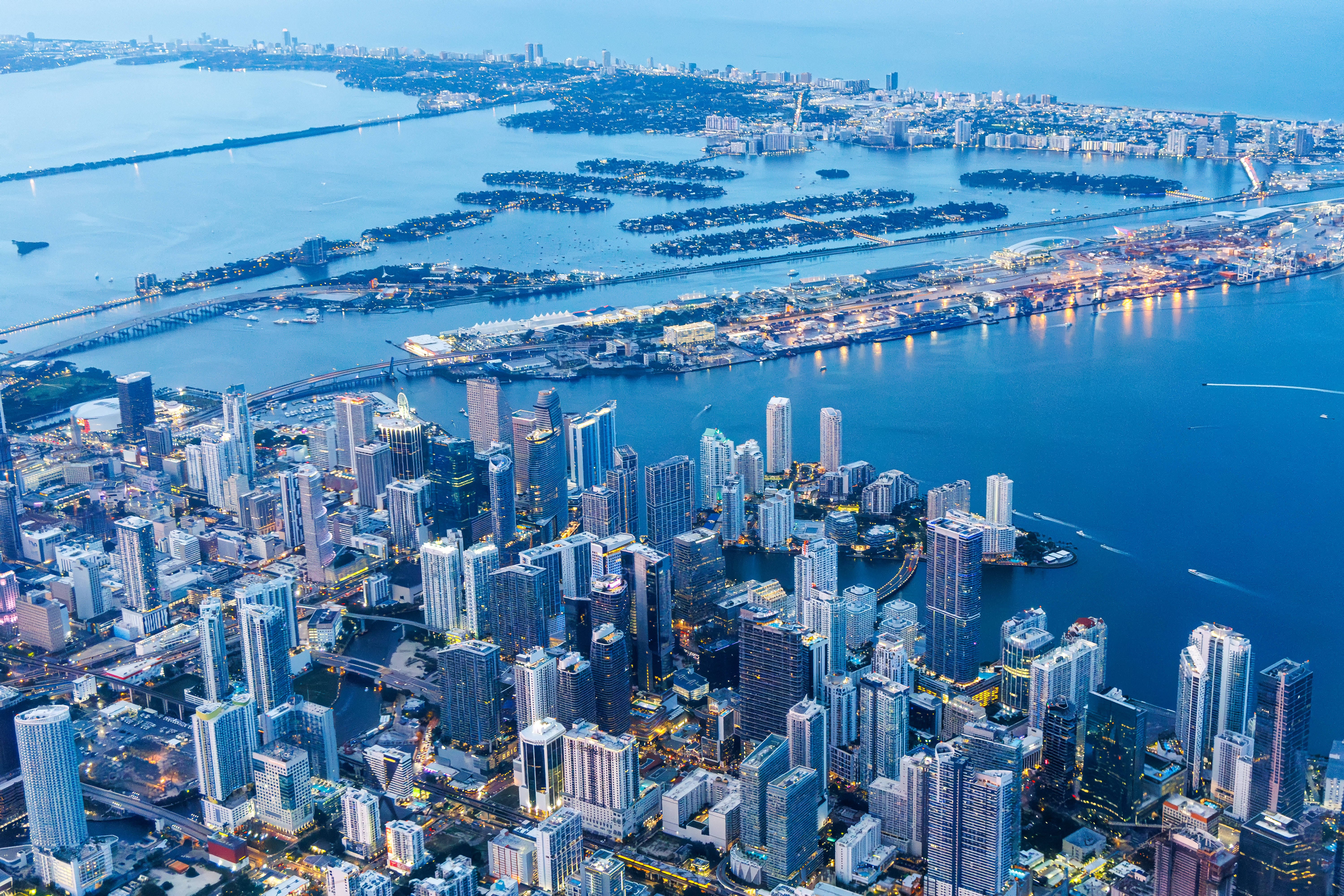 Aerial view of Miami skyline with skyscrapers, Downtown Brickell, and Miami Beach at night in Miami on June 22, 2024.