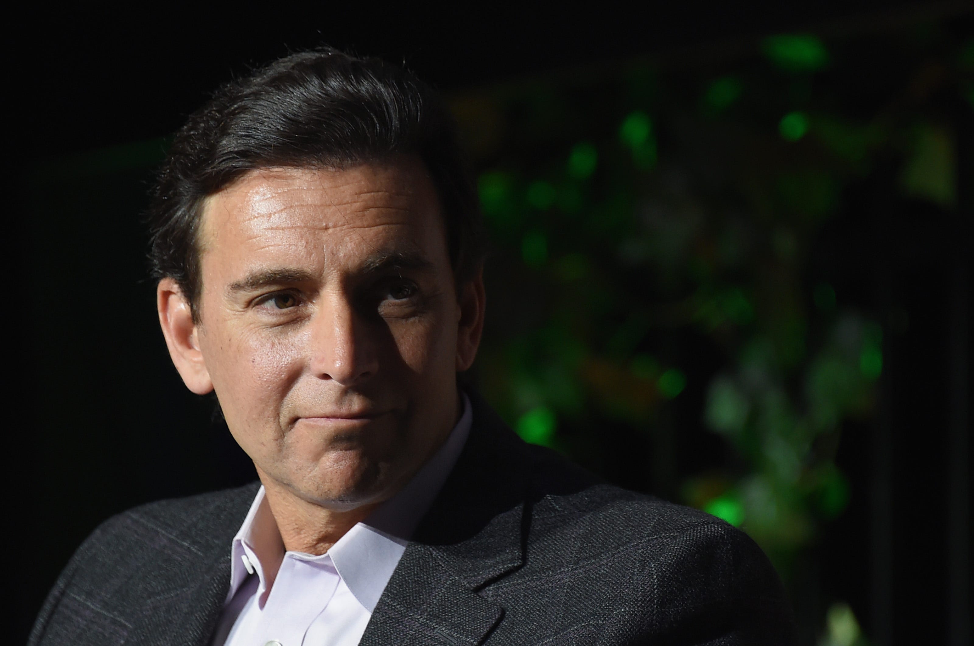 Mark Fields, the former CEO of Ford, is dressed in a white shirt and black blazer.