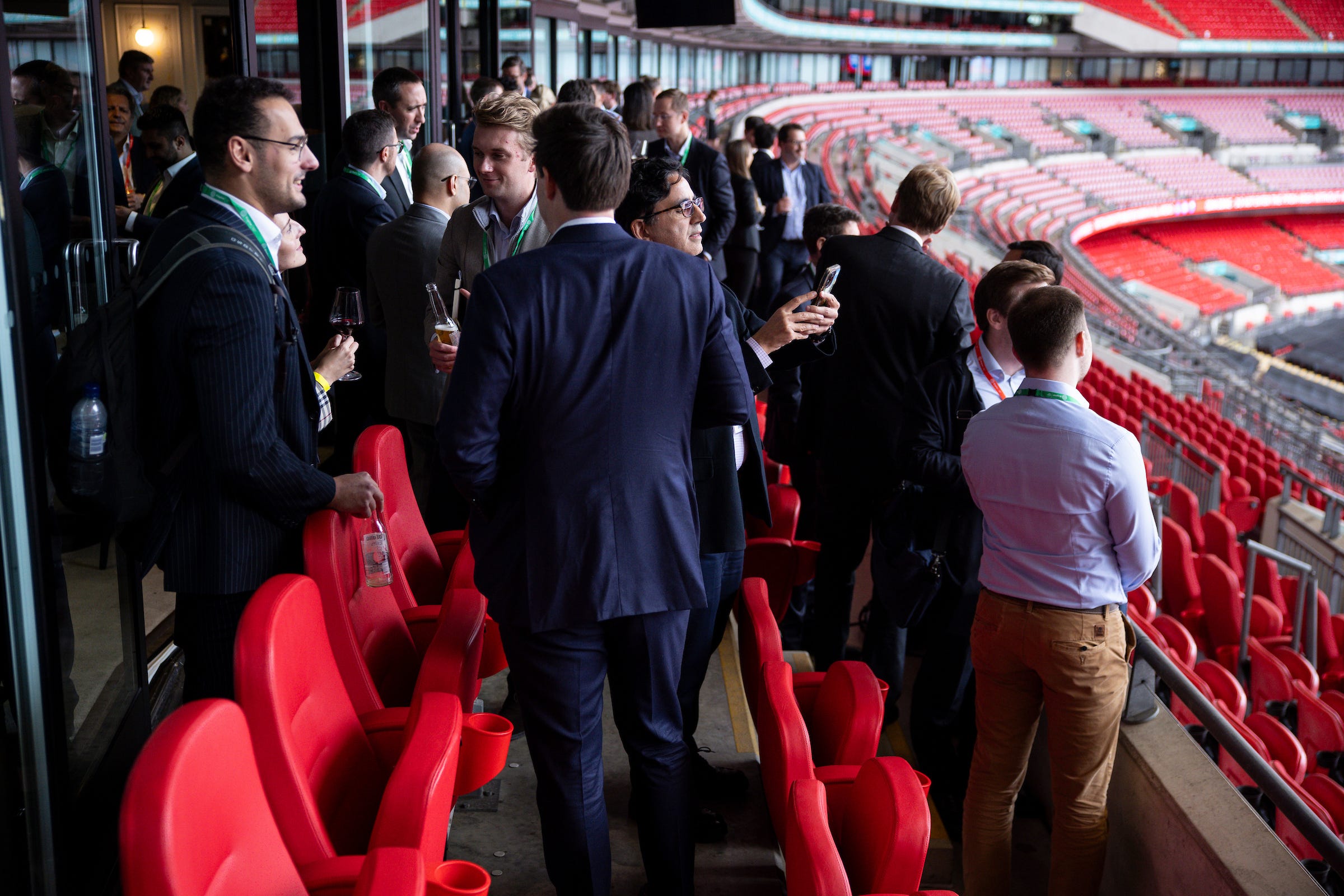Conference attendees network at London's historic Wembley Stadium