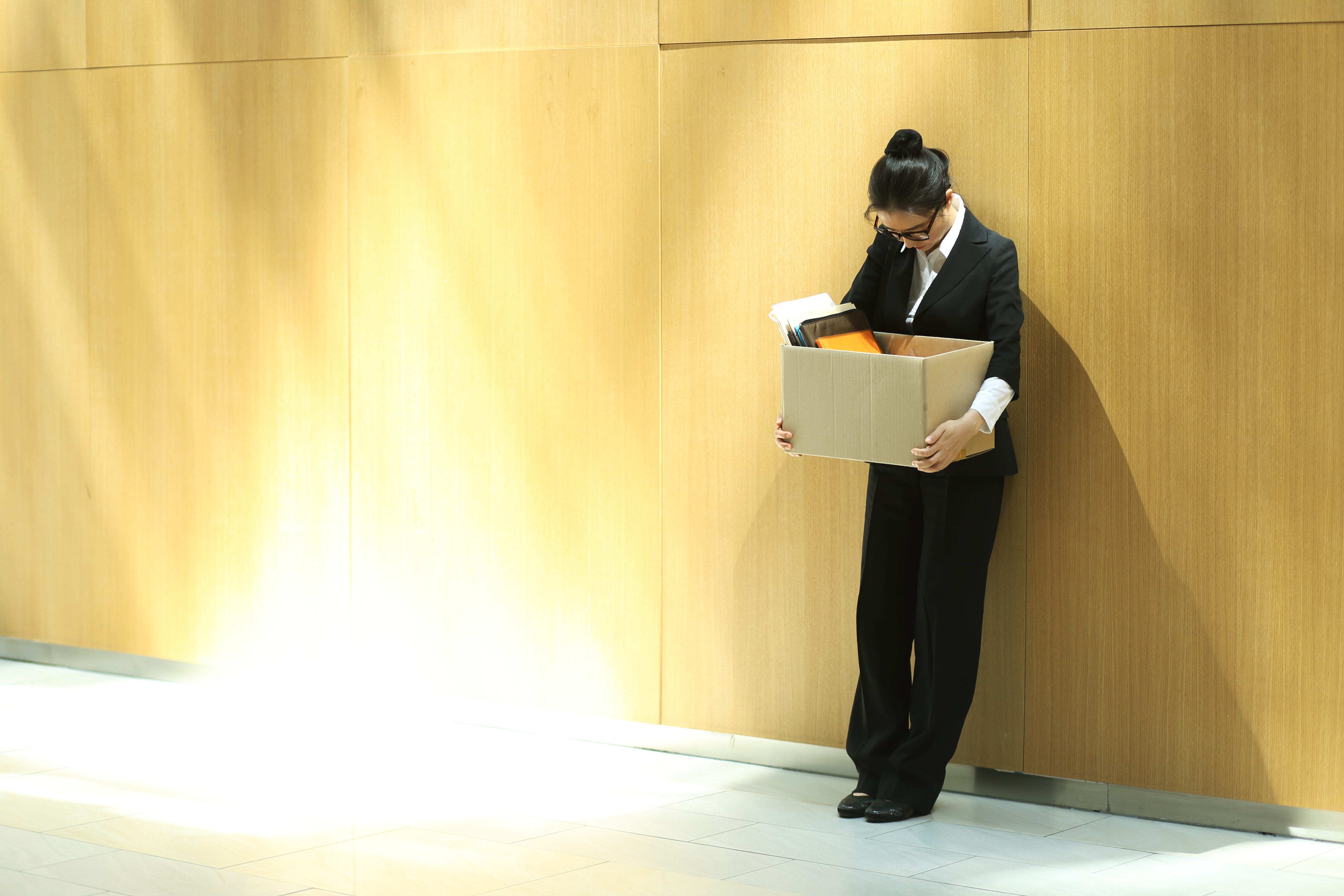 A woman holding a box.