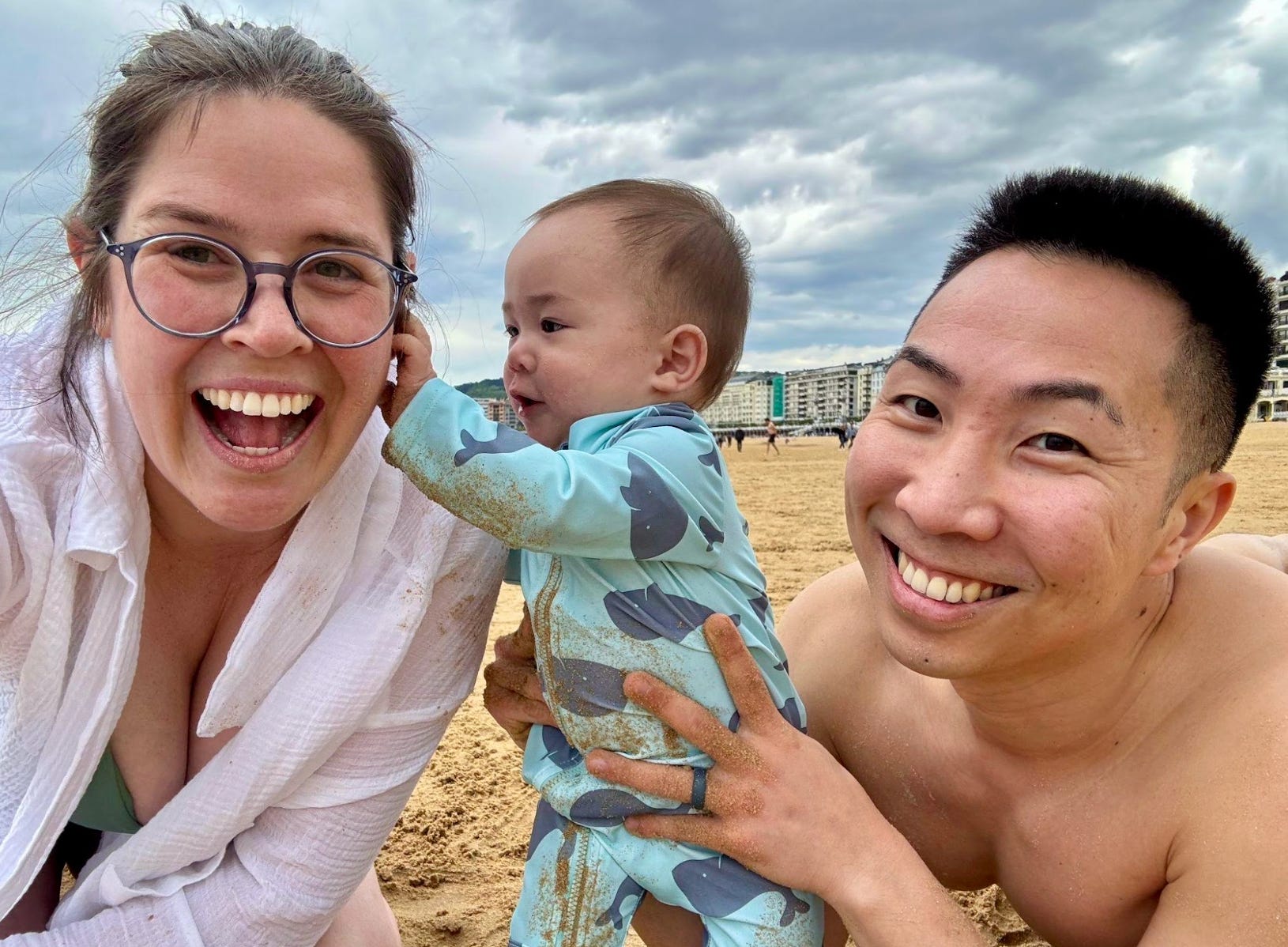 The writer, her husband, and her baby on the beach in San Sebastian, Spain.