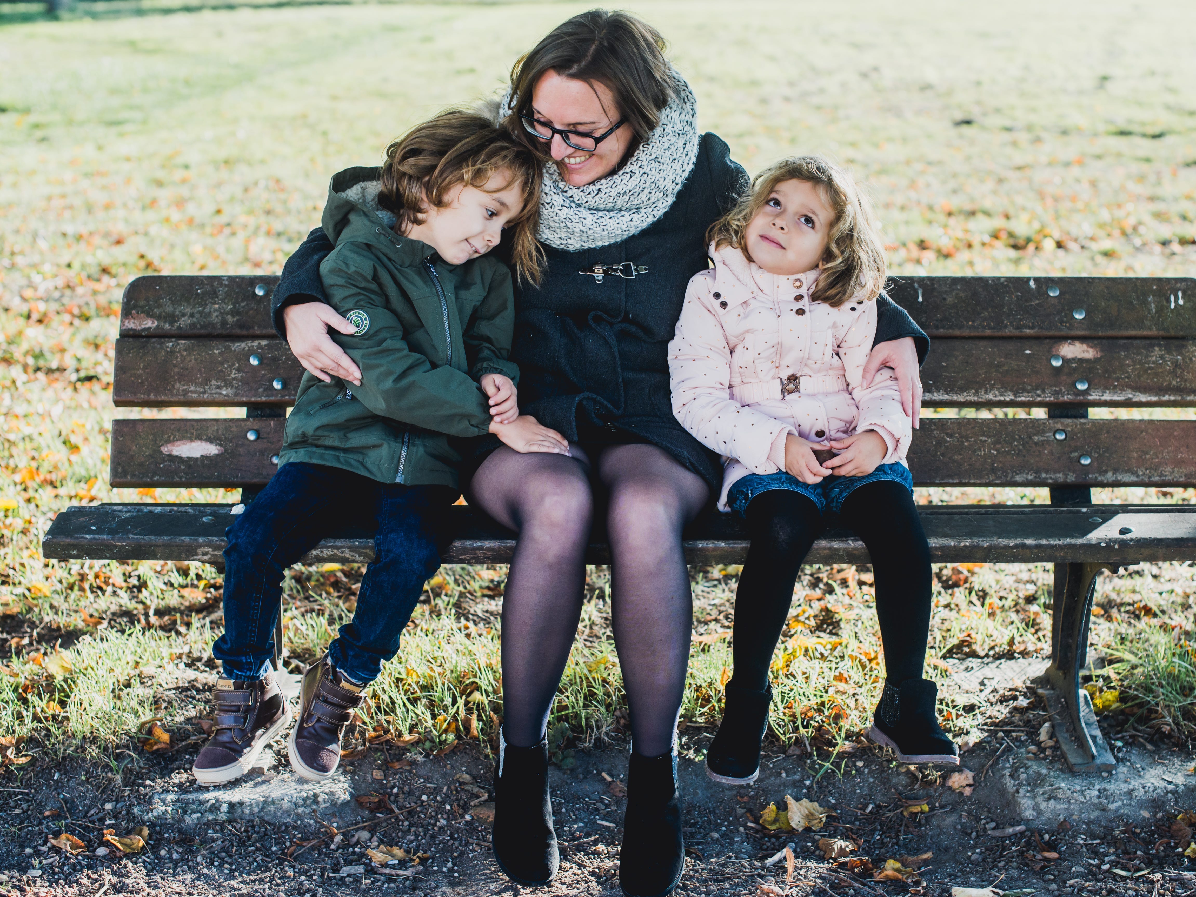 Bérangère Bégout and her two kids on a bench
