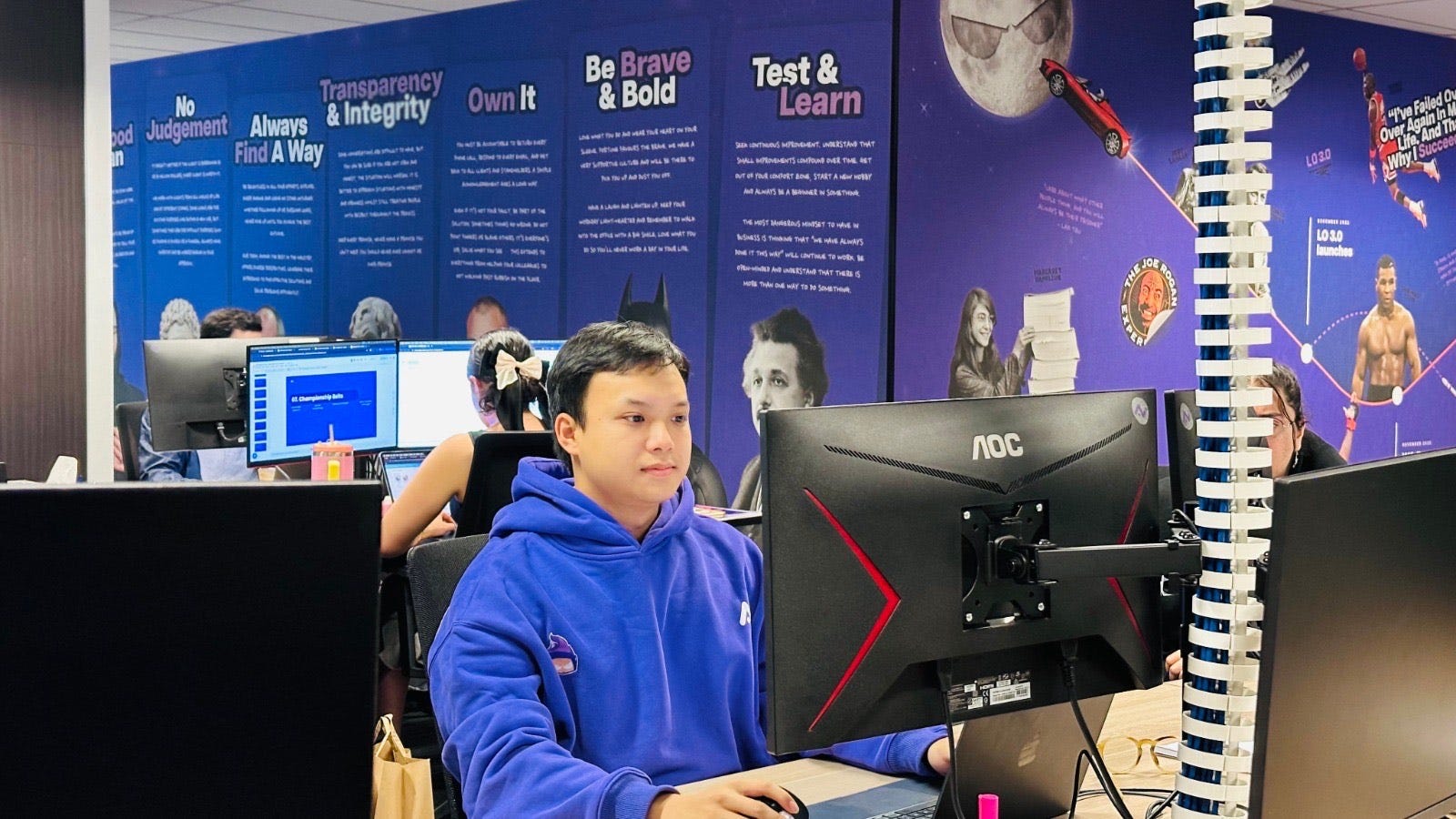 Hung Nguyen at a computer