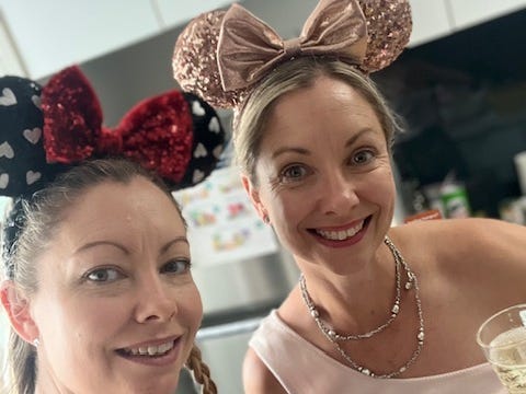 Identical twins with Minnie Mouse ears