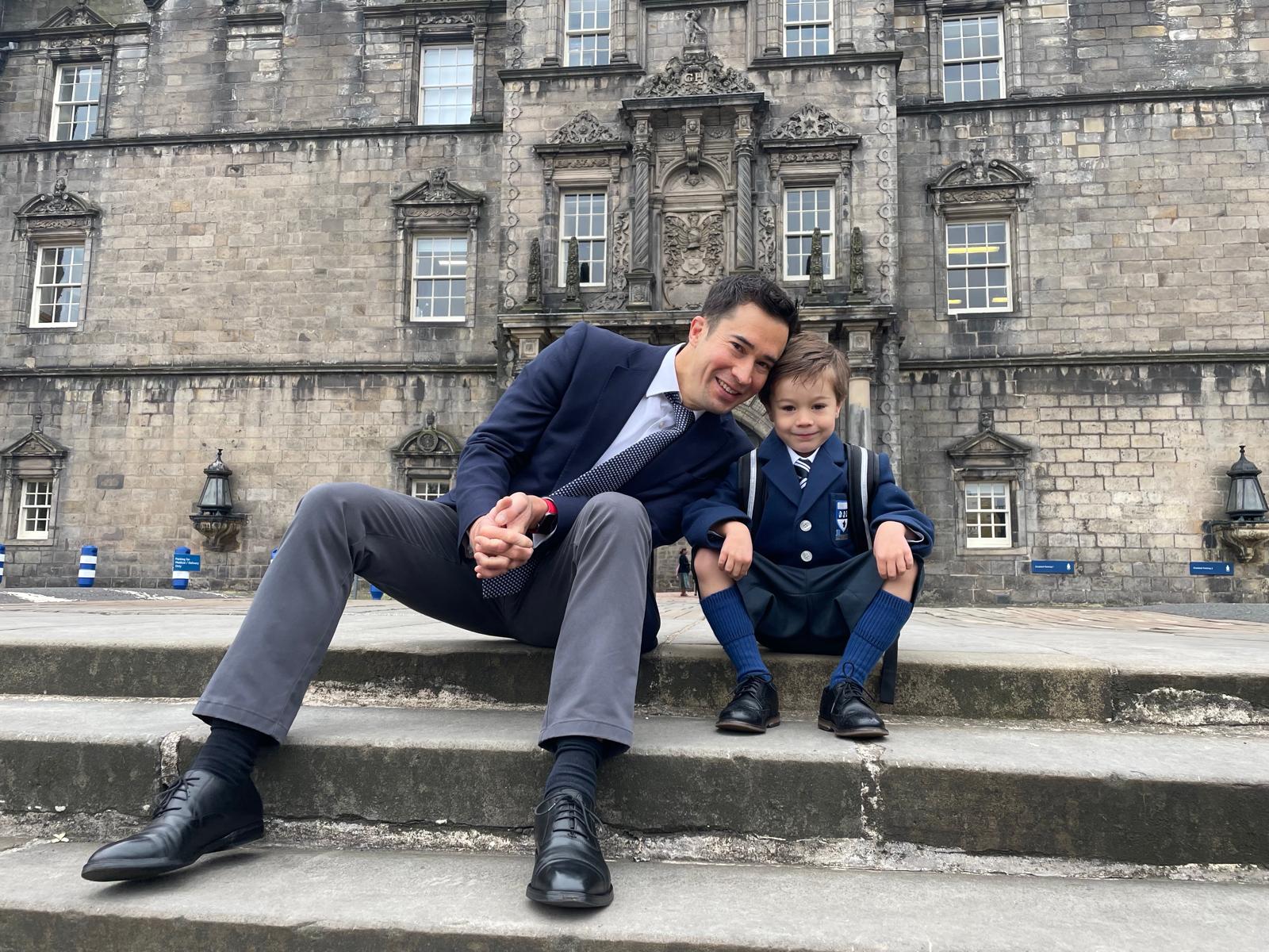 The author posing with his son.