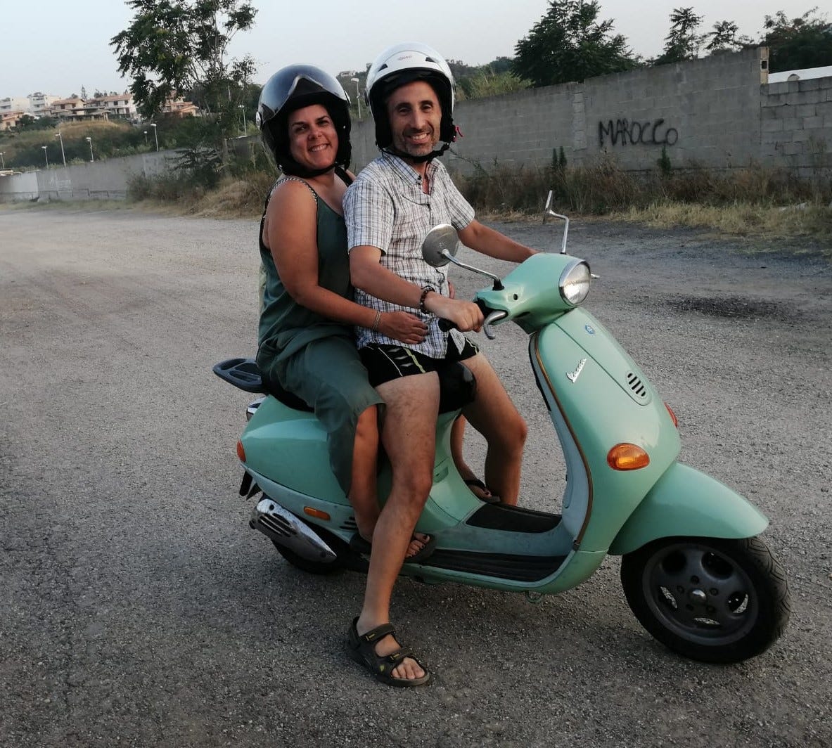 Woman and man on vespa
