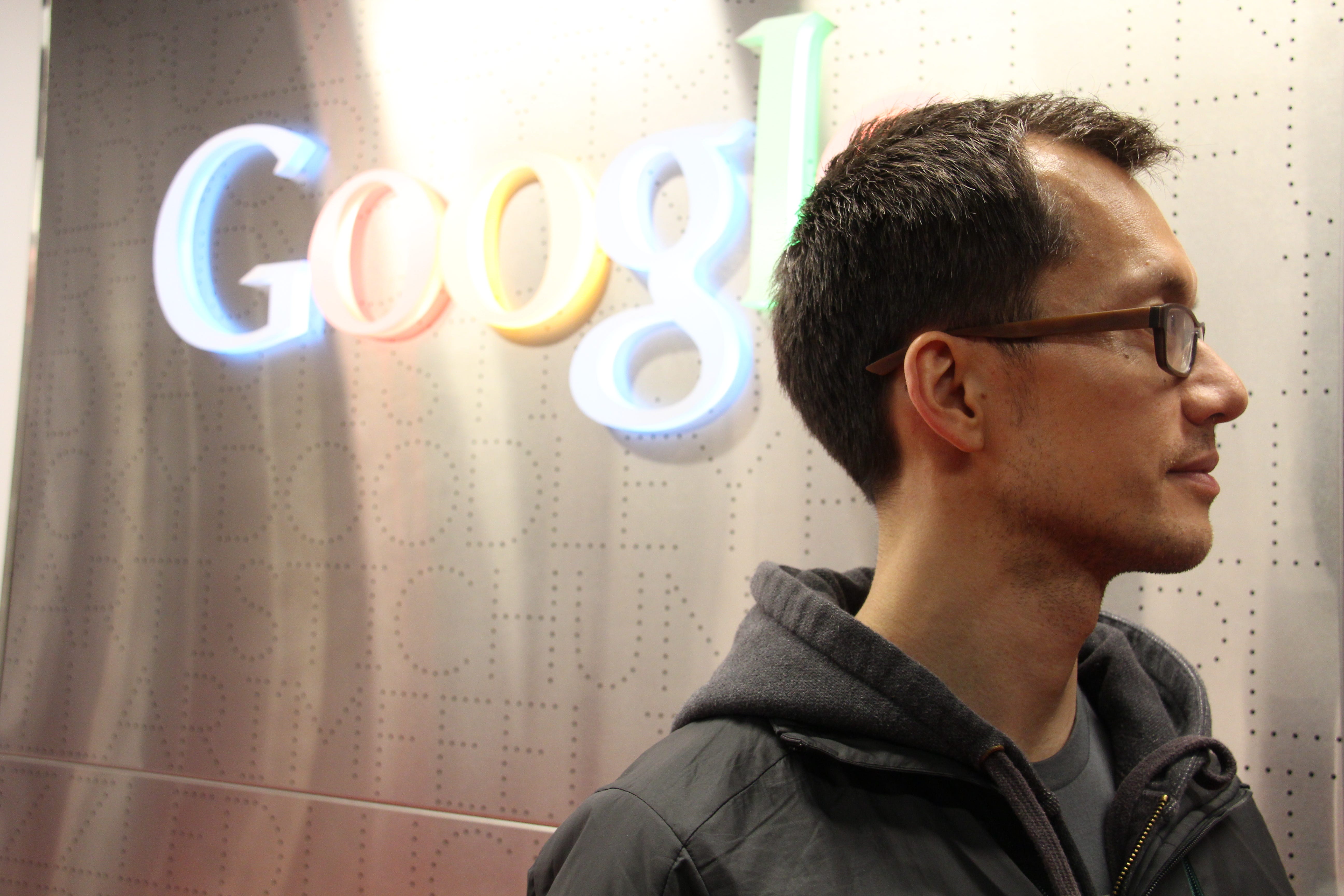 Patrick Leung standing in front of a Google sign