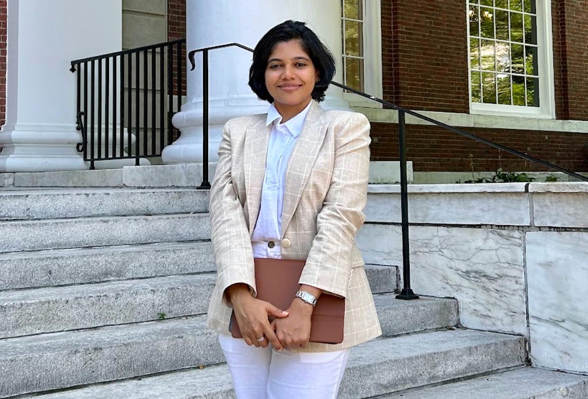 Shreya Mishra Reddy standing on outdoor steps outside a building.
