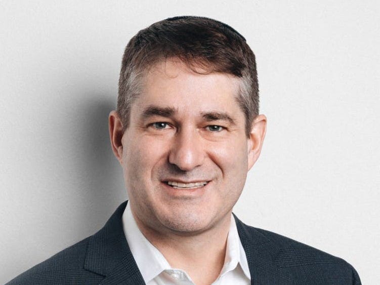 headshot of a man with a white background