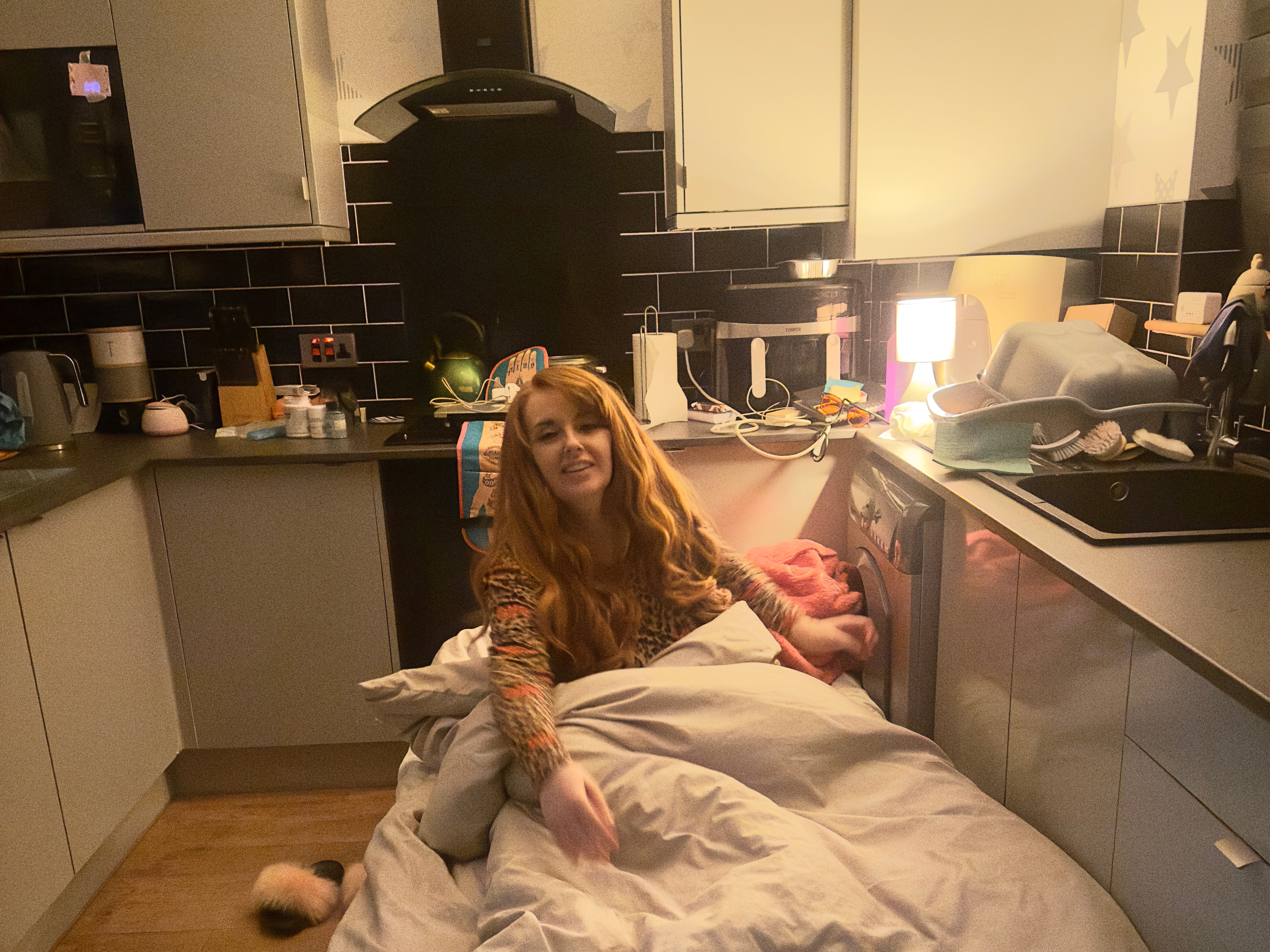 Woman sleeping on kitchen