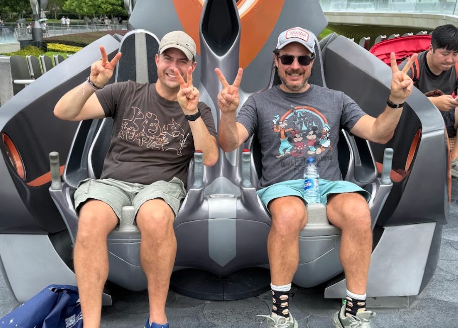 The writer and his best friend on a ride at Disney Shanghai.