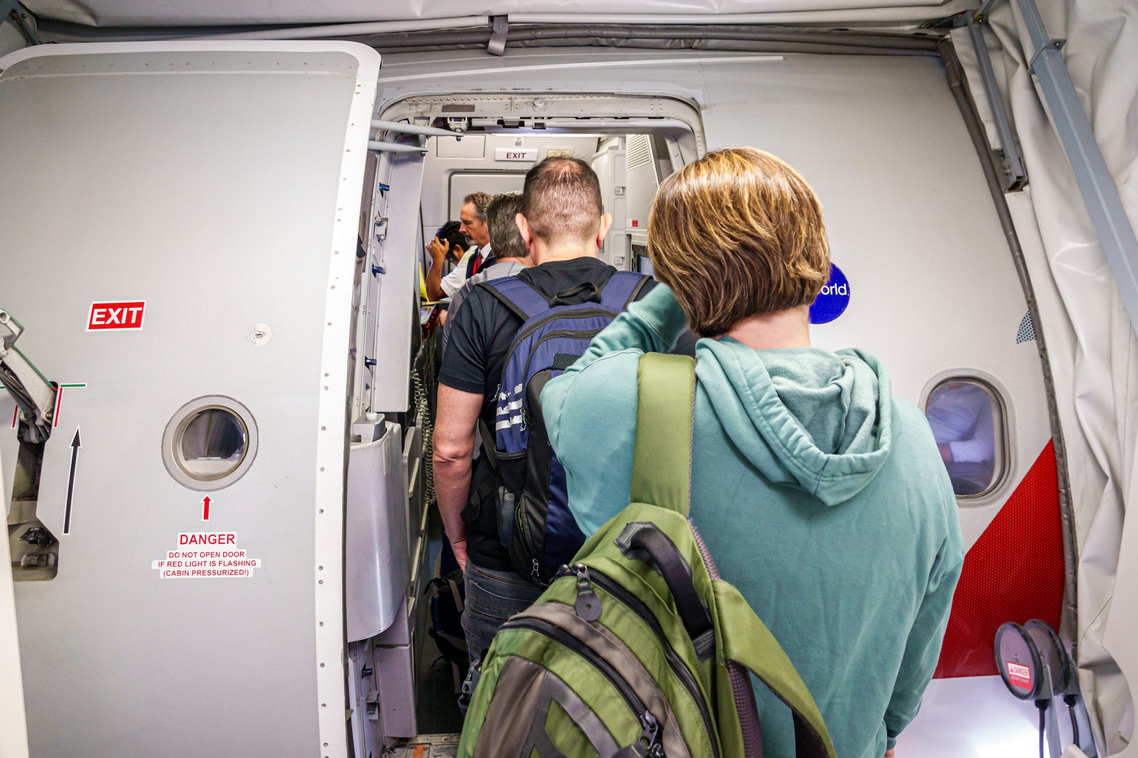 People boarding an American Airlines' flight in Mexico.