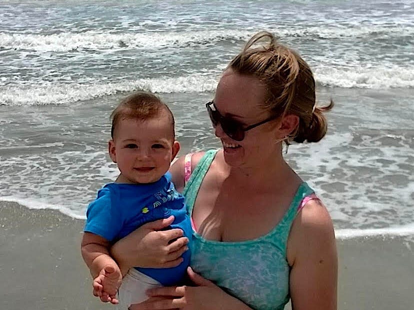 The author with her son as an infant at the beach.