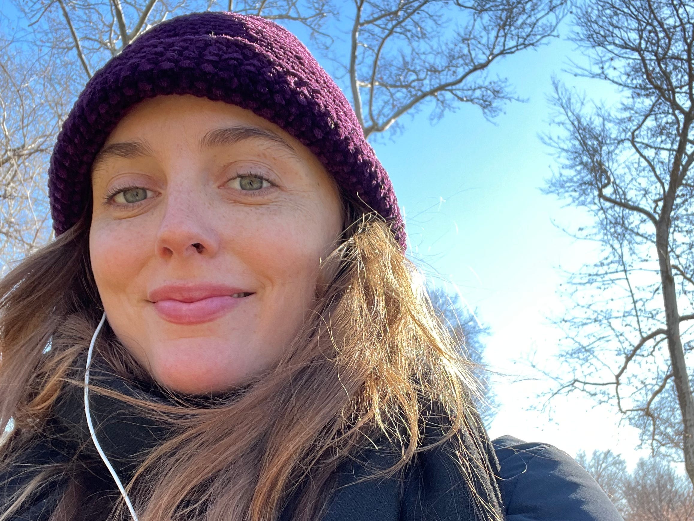 grace posing for a selfie walking through a park in philly