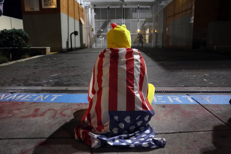 PORTLAND, OREGON - OCTOBER 03: Demonstrators seen as federal agents, including members of the Department of Homeland Security, and the Border Patrol, hold back protesters outside a downtown U.S. Immigration and Customs Enforcement (ICE) facility on October 03, 2025 in Portland, Oregon. The facility has become a focal point of nightly protests against the Trump administration and his announcement that he will be sending National Guard troops into Portland. A federal judge is currently hearing Oregon’s case against sending troops into the city, and a decision is expected on Saturday.  (Photo by Spencer Platt/Getty Images)