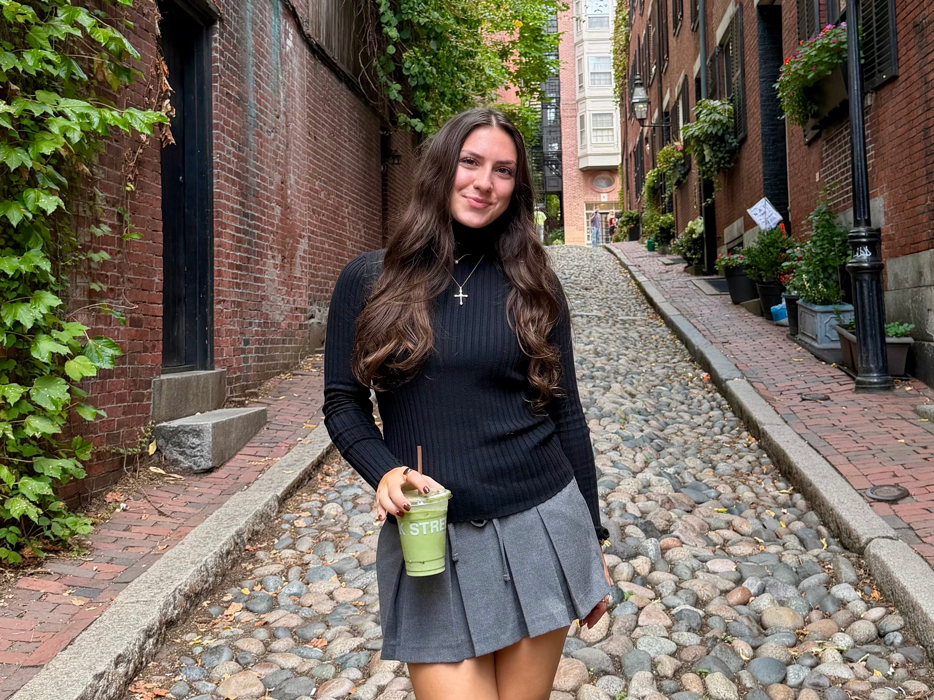 Amanda standing on Acorn Street in Boston, Massachusetts.