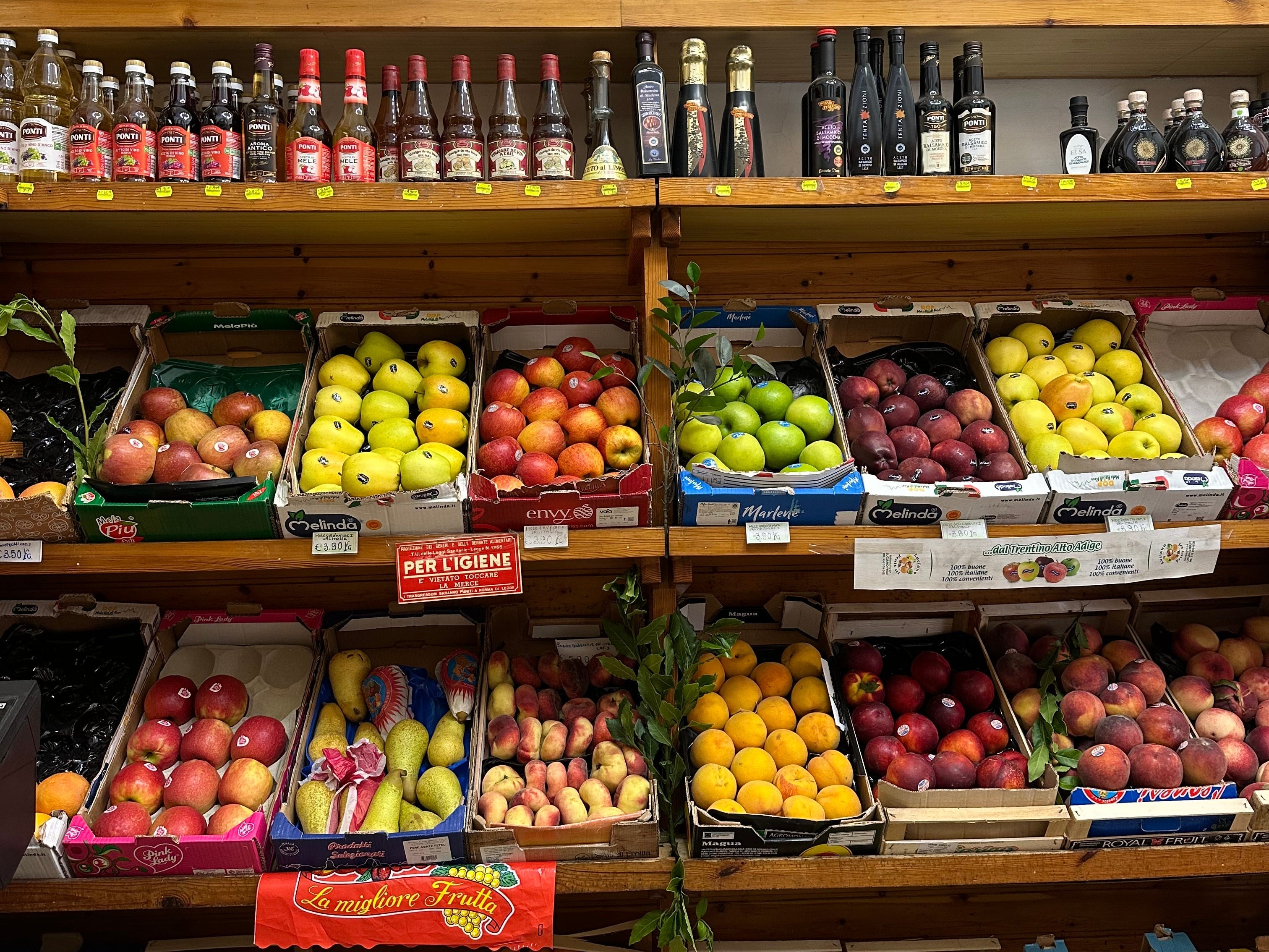 A display of fresh produce in an Italian grocery store.