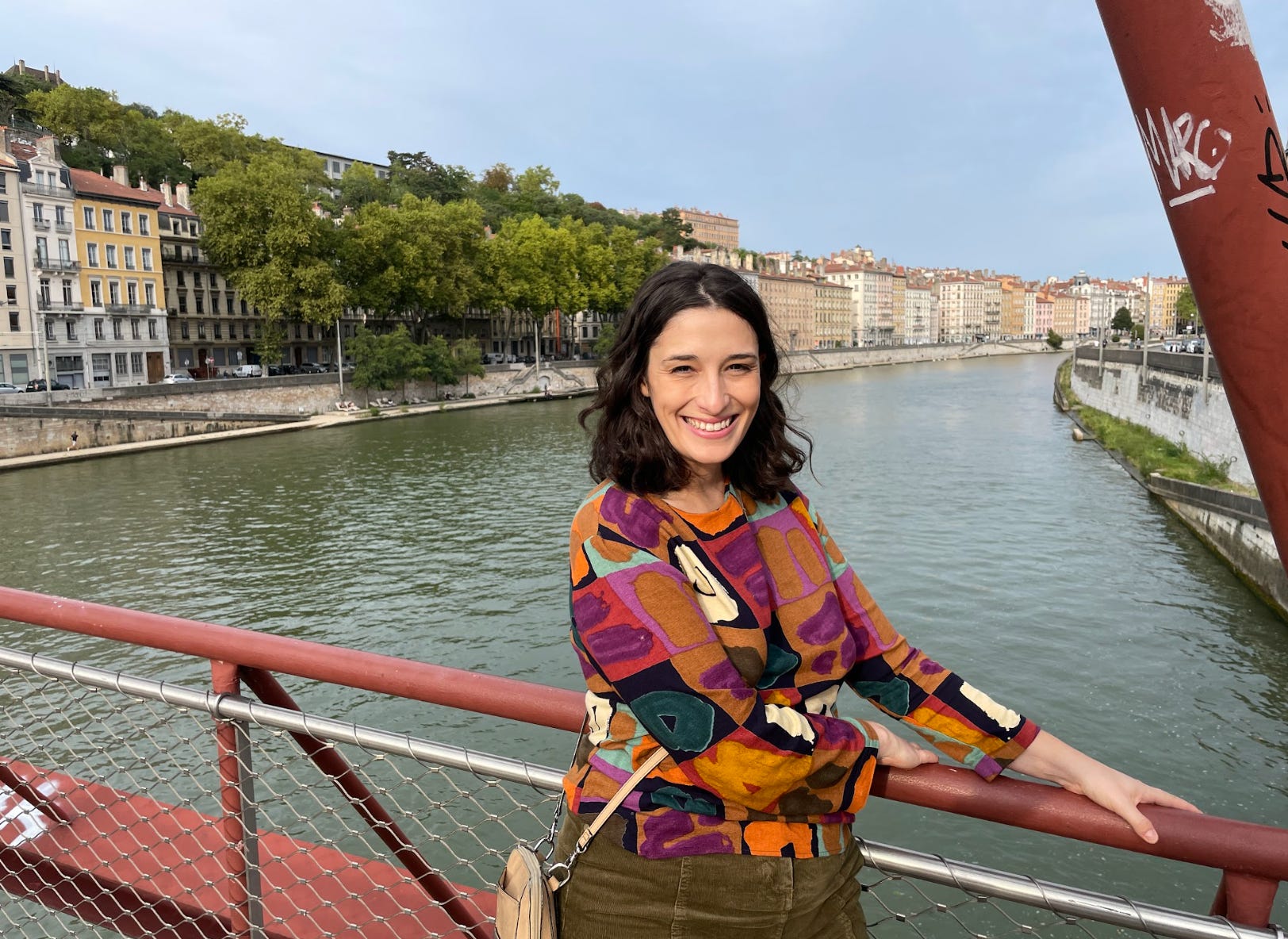 The writer standing near the water in France.