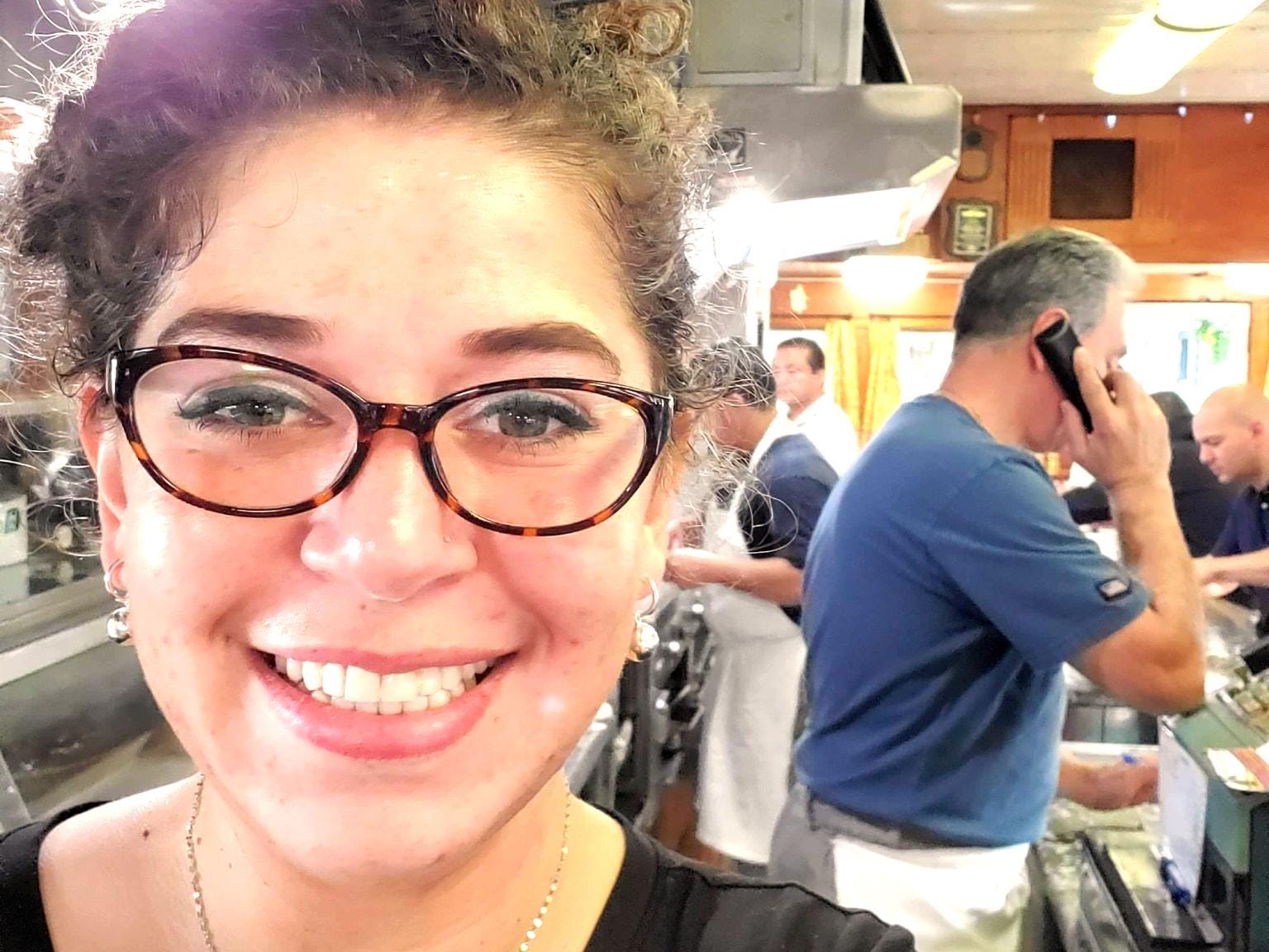 Selfie of Maelin Mejias behind the counter at Summit Diner.