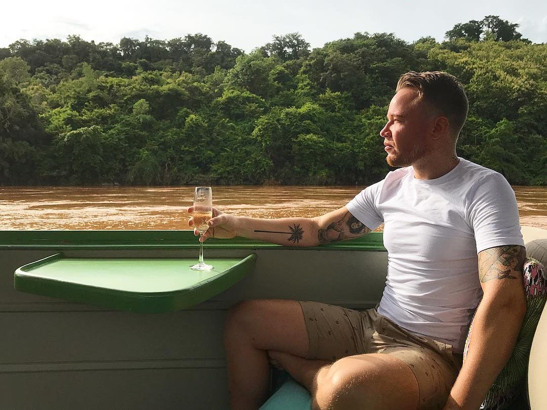 Andre Neveling on a boat in Luang Prabang, Laos.
