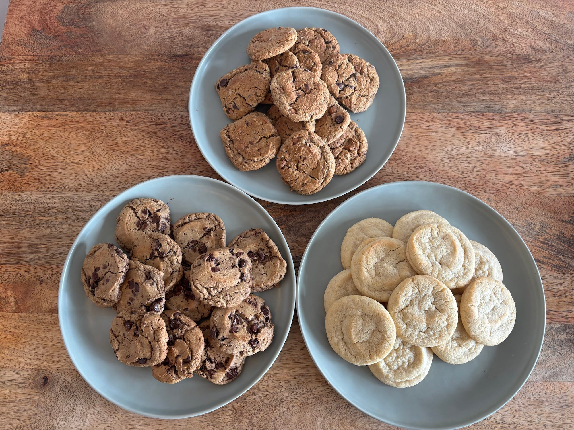 Three plates full of cookies.
