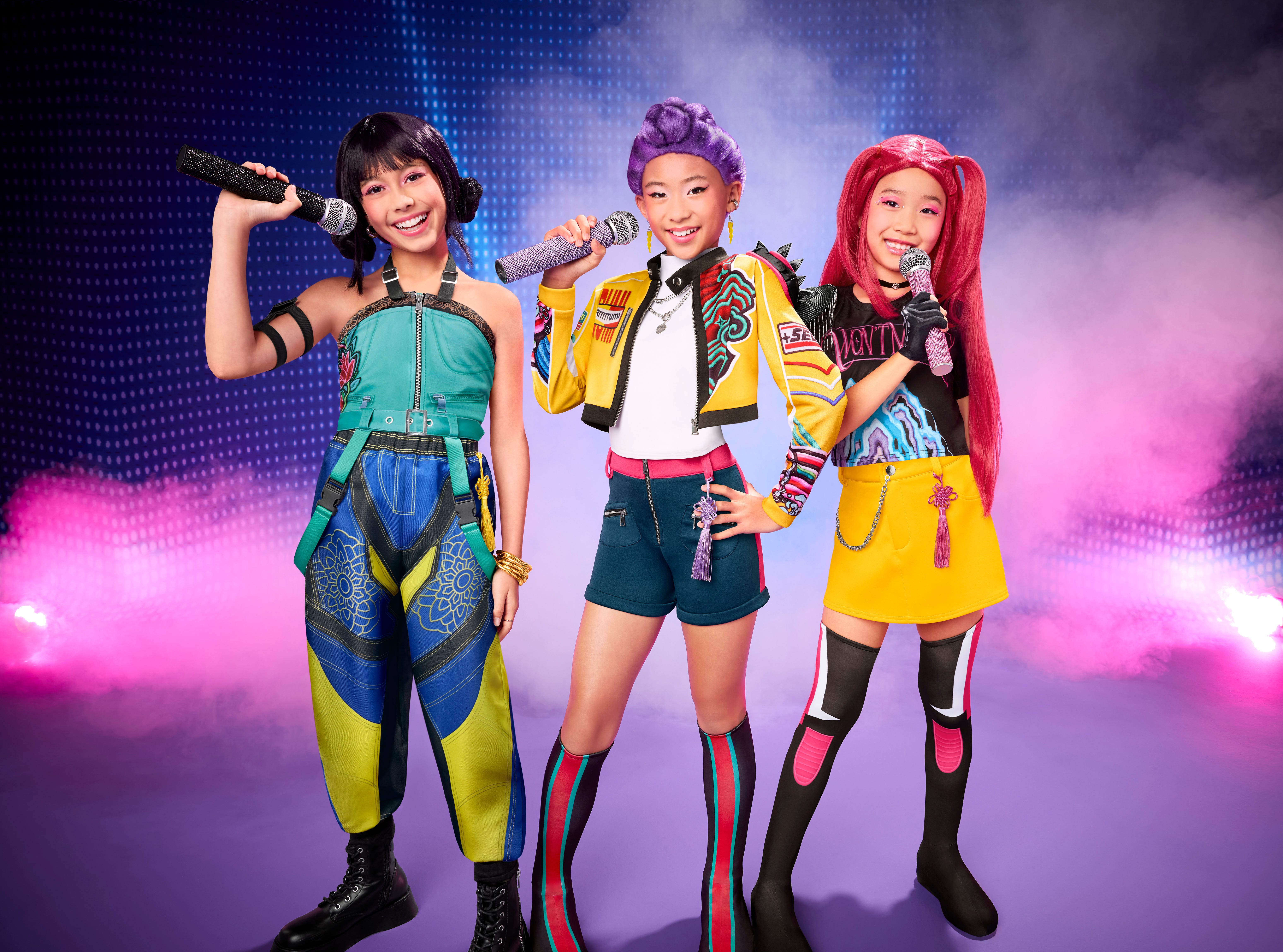 three girls in k-pop demon hunters costumes