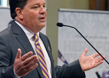 LSU athletic director Scott Woodward resigns, 4 days after the firing of football coach Brian Kelly