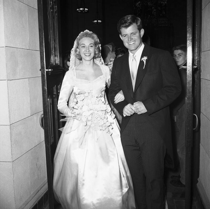 Edward Moore Kennedy, son of former U.S. Ambassador to Britain Joseph P. Kennedy, smilingly poses with his bride, post-debutante Joan Bennett, after their wedding ceremony at St. Joseph's Church