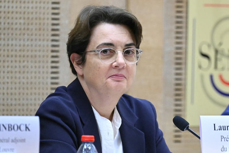 President of the Louvre Museum Laurence des Cars looks on prior to the start of a hearing before the Senate's culture committee at the French Senate in Paris on October 22, 2025. Laurence des Cars has not made any public statement since the theft on October 19, 2025. Des Cars, who became the first woman to run the Louvre in 2021, is expected to be questioned about security at the Apollo Gallery, which houses the royal collection of gems. The museum on October 21, 2025 hit back at criticism that the display cases protecting the stolen jewellery were fragile, saying they were installed in 2019 and