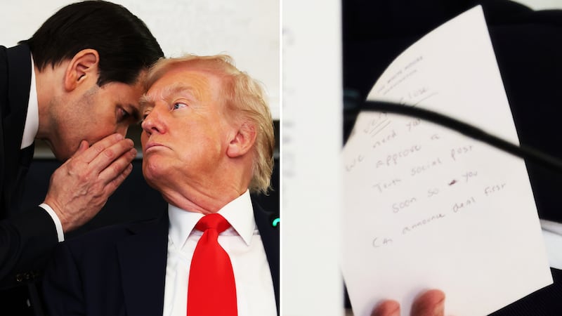 Secretary of State Marco Rubio writes a note before handing it to President Donald Trump during a roundtable meeting on antifa in the State Dining Room at the White House, Wednesday, Oct. 8, 2025, in Washington.