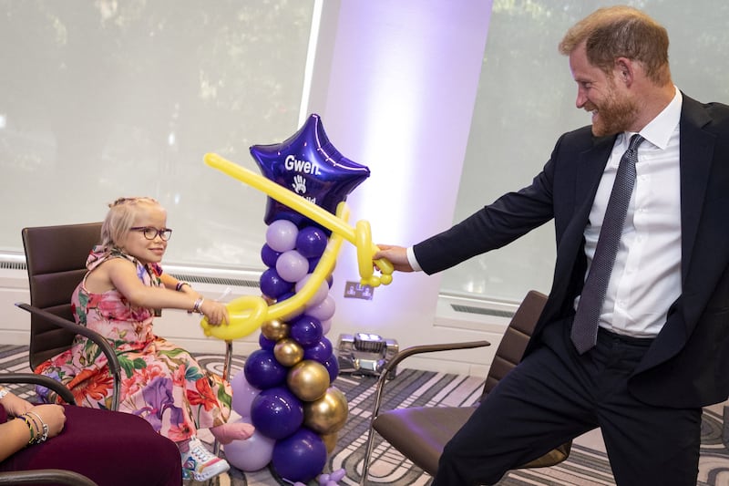 Prince Harry, Duke of Sussex, plays sword fighting with modelling balloons with nine-year-old Gwen Foster, recipient of Inspirational Child 7-11 award, at the annual WellChild Awards 2025, which celebrates the achievements and resilience of seriously ill youngsters and their families, at the Royal Lancaster Hotel in London, Britain September 8, 2025.