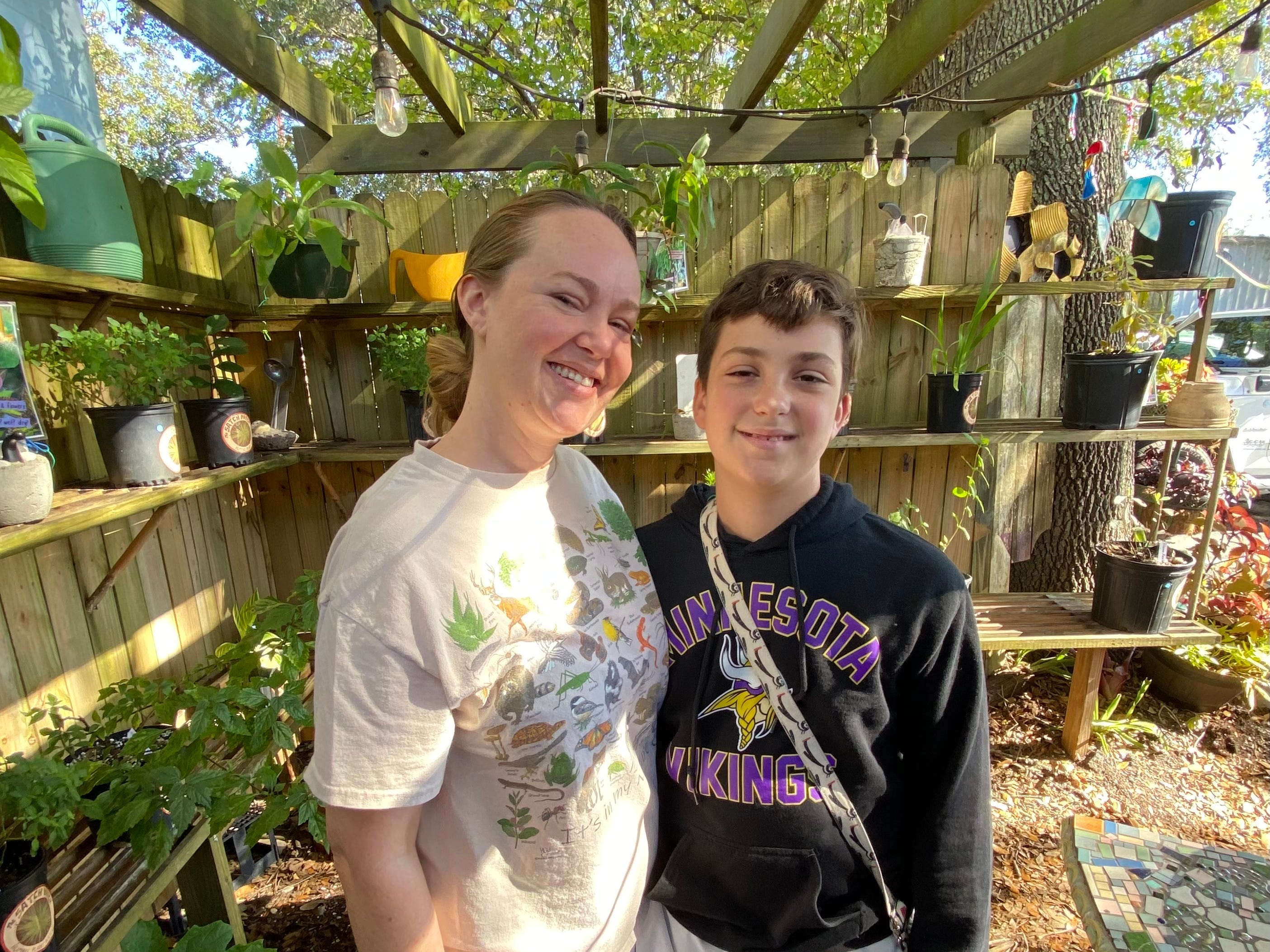 The author with her son in a garden shed.
