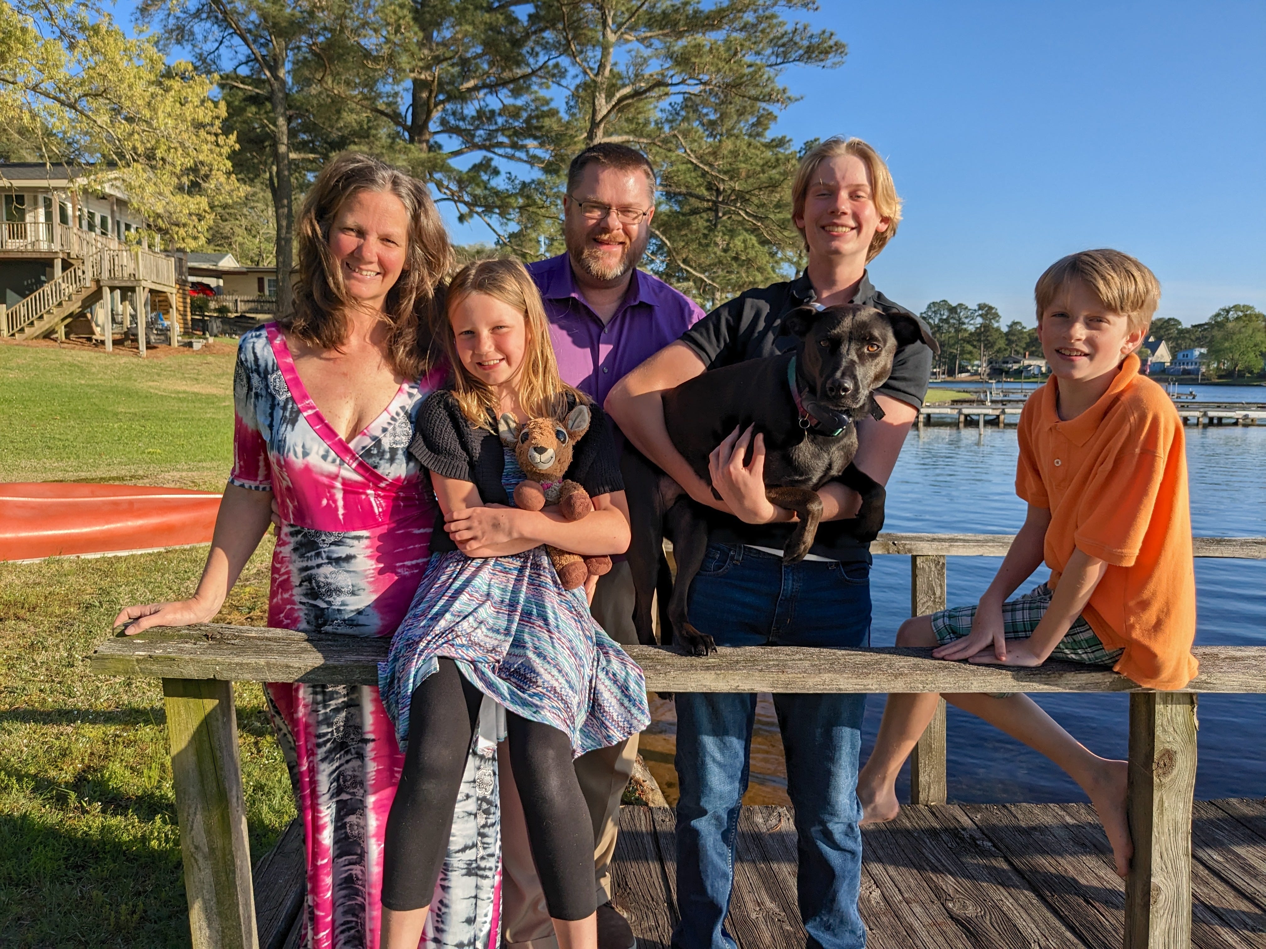 The author and her family stand on a dock near the home they moved to near the author's hometown.