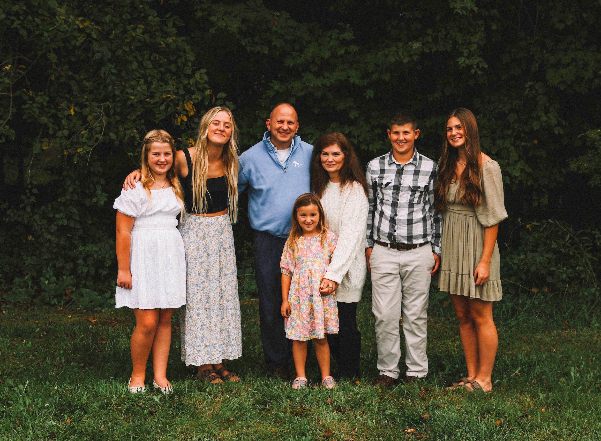Grandparents with grandkids posing for photo