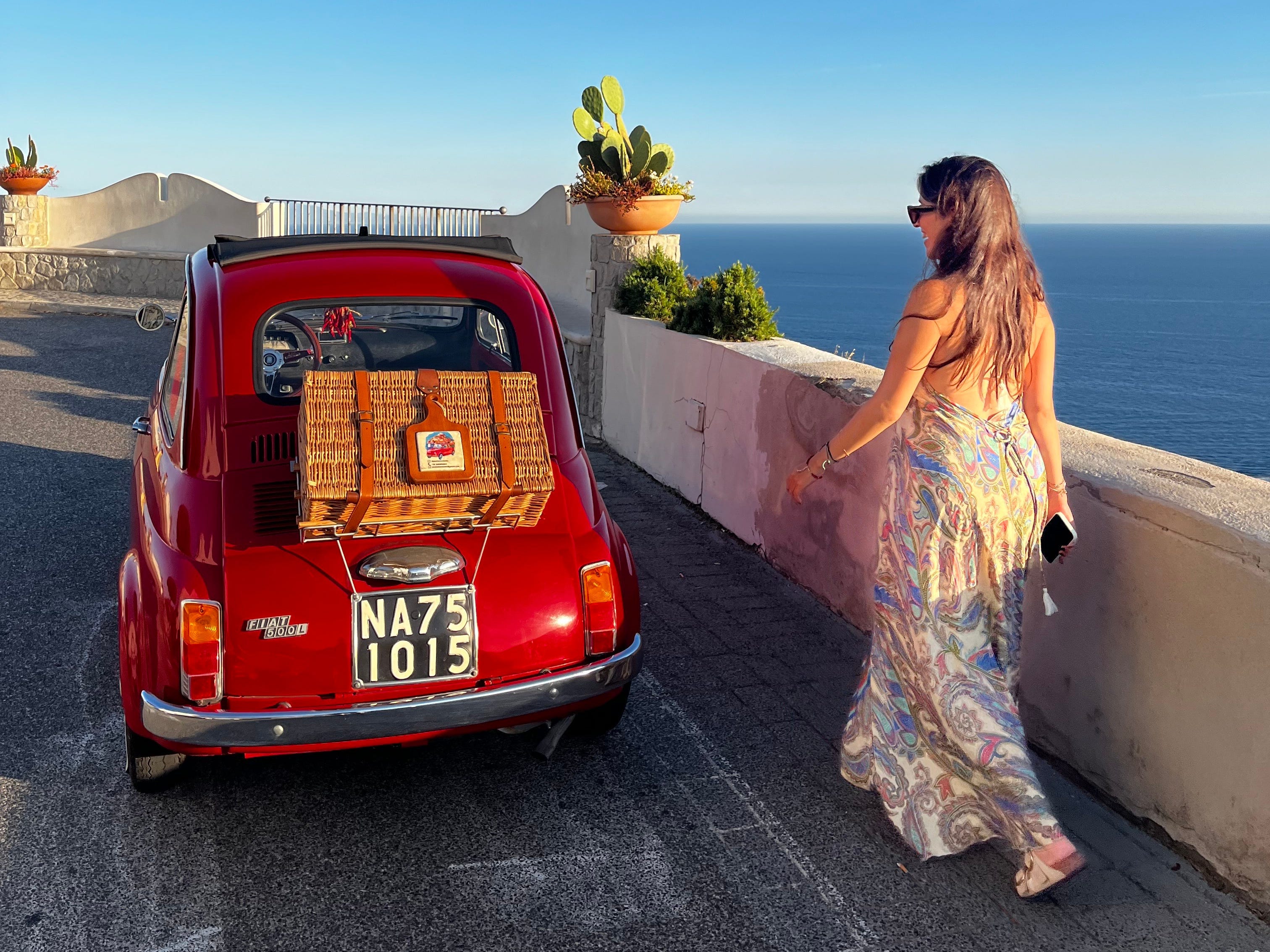 Santiago Barraza Lopez's partner next to a car in italy