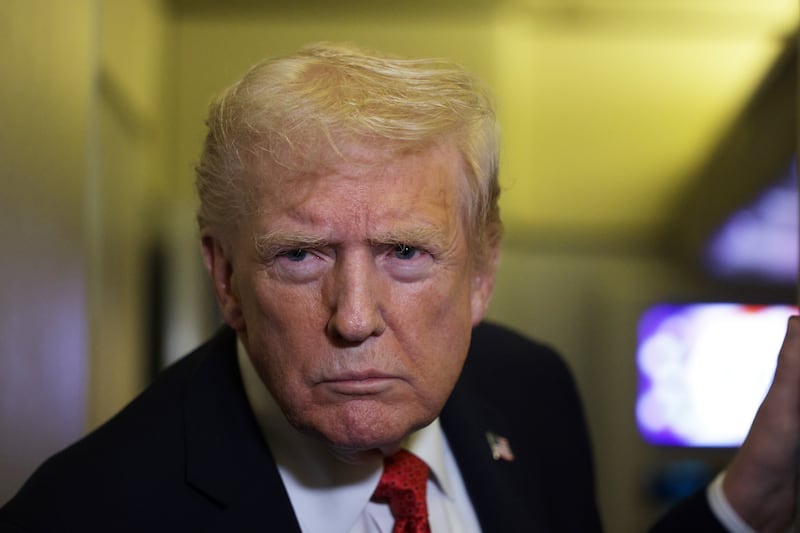 IN FLIGHT - OCTOBER 19: U.S. President Donald Trump speaks to members of the press on October 19, 2025 aboard Air Force One. The President is returning to Washington, DC, after spending his weekend at Mar-a-Lago resort in Palm Beach, Florida. (Photo by Alex Wong/Getty Images)