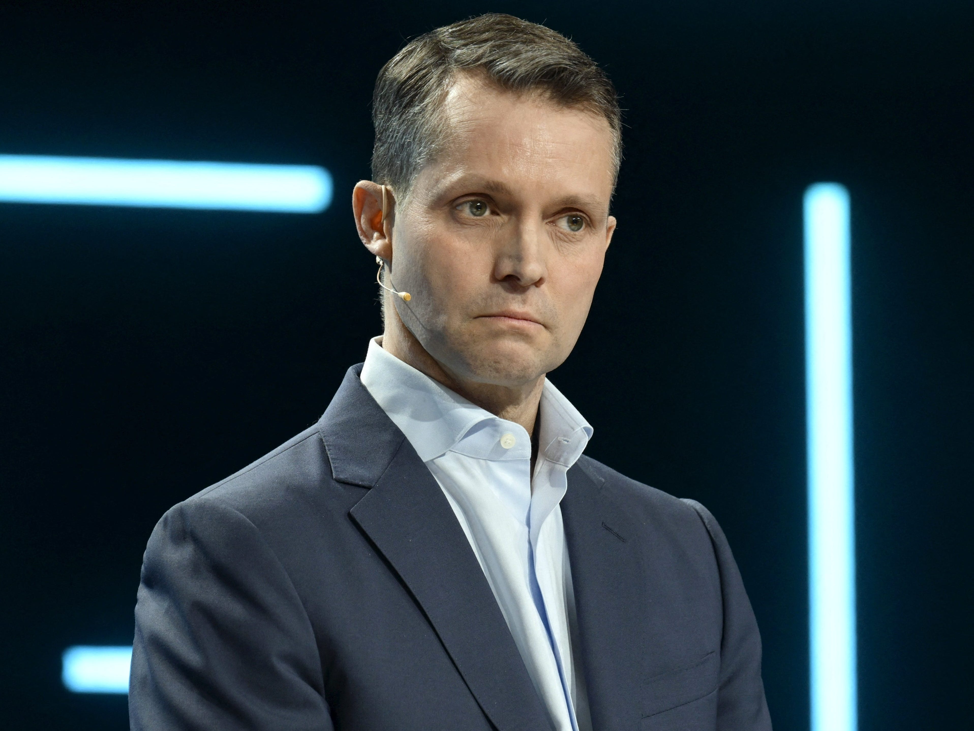 Nokia CEO Justin Hotard is wearing a light blue shirt and a gray jacket.