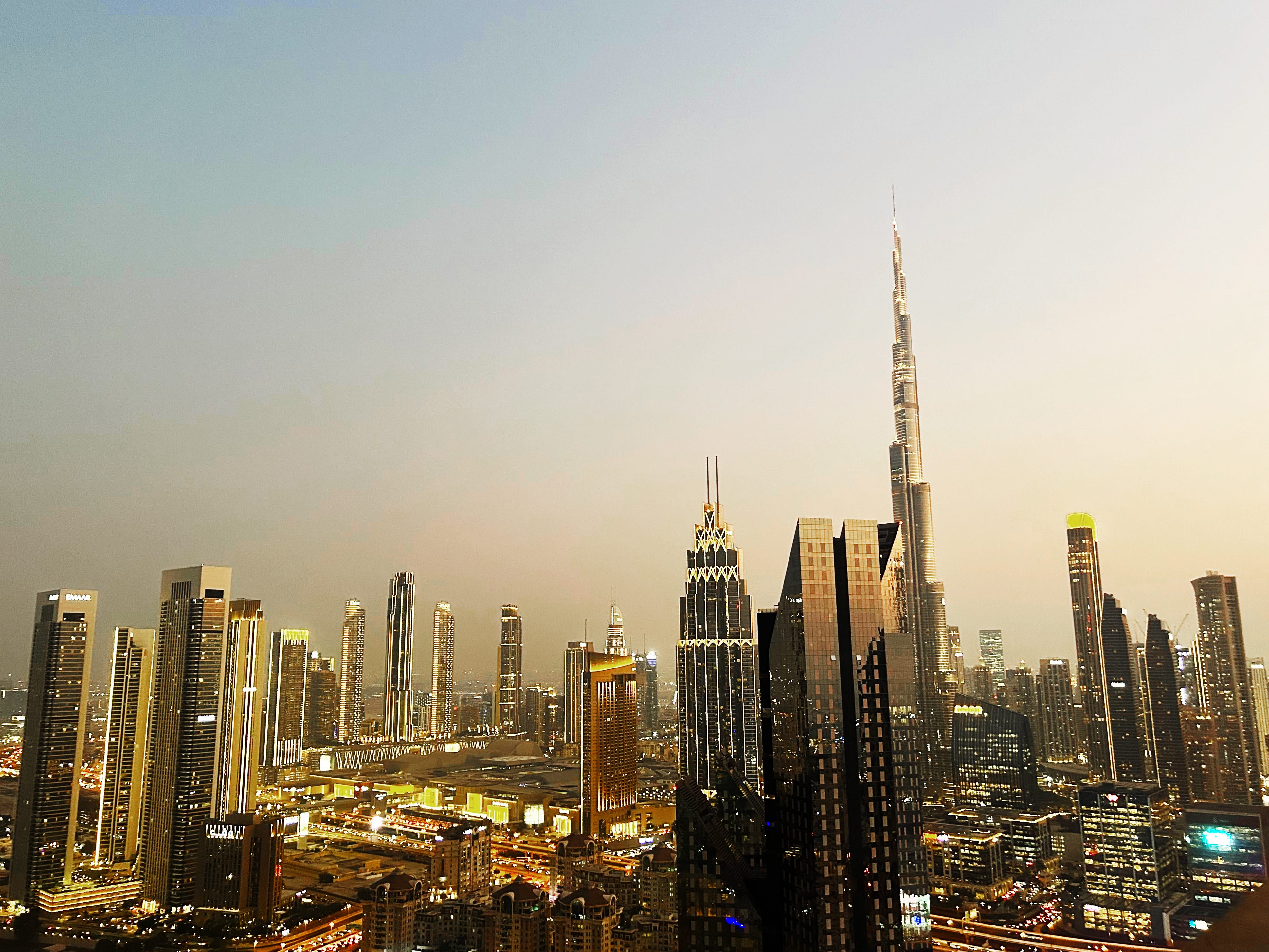 The skyline of Dubai, including the Burj Khalifa, as seen from a rooftop in the DIFC.