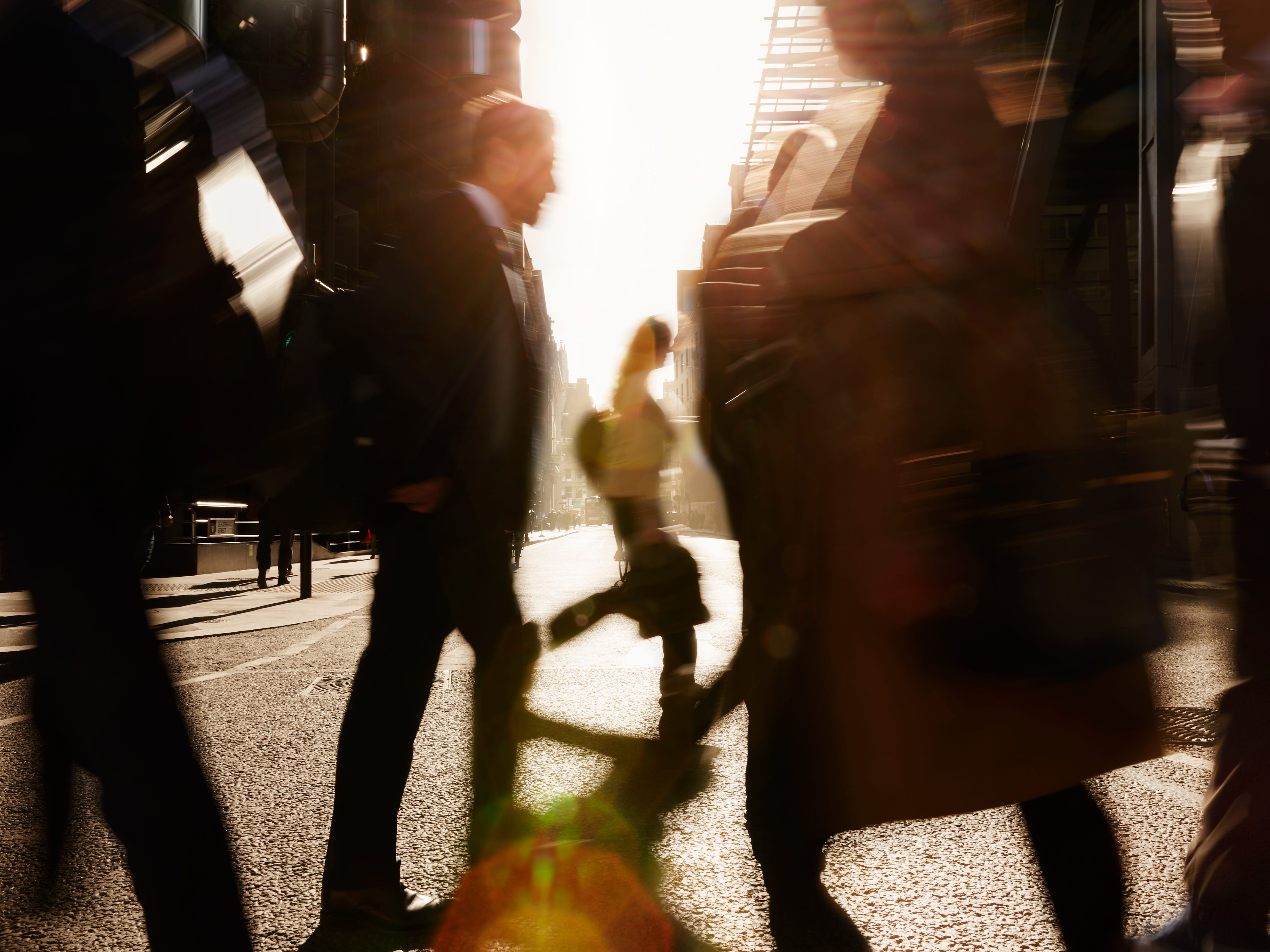 A blurry photo of people walking