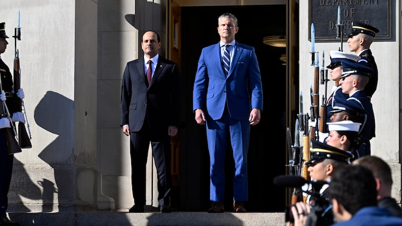 Qatari Defense Minister Sheikh Saoud Al Thani (L) stands with Secretary of War Pete Hegseth during a welcoming ceremony at the Pentagon on October 10, 2025 in Arlington, Virginia. Hegseth announced today that the Pentagon has agreed to host a new Qatari Emeri air force facility at the Mountain Home Airbase in Idaho.